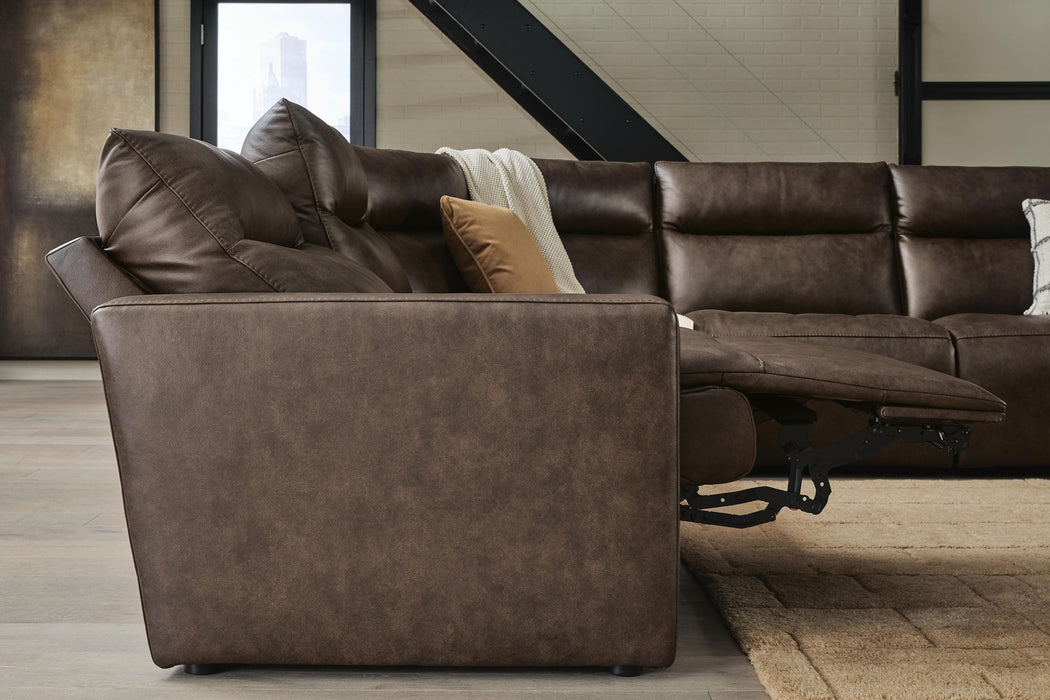 Benchcraft® ModZ 7-piece power reclining sectional sofa with plush cushions and reclining seats in a modern living room setting.