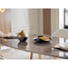 Bellona Veronica dining table with sleek wooden surface and modern design, shown in a well-lit dining room setting.