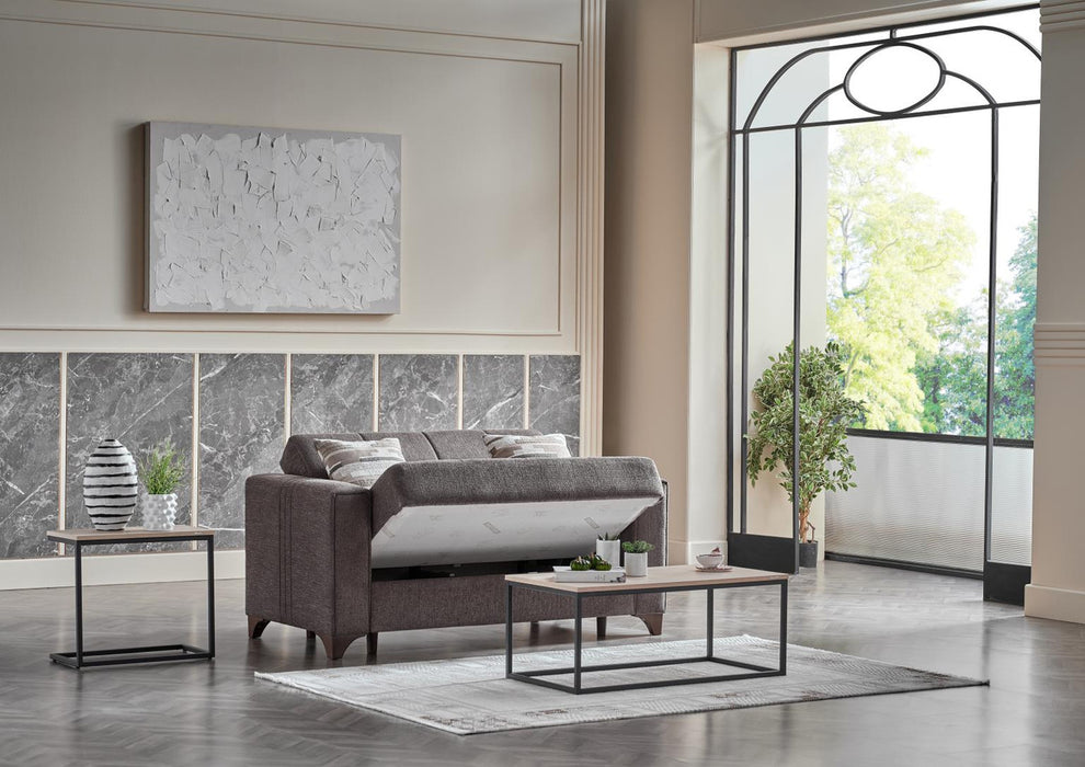 Bellona Parma love seat with plush beige upholstery and sleek wooden legs, designed for comfortable seating in modern living rooms.