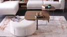 Bellona Atlanta upholstered ottoman with a soft fabric surface and wooden legs, stylish addition to living room decor.