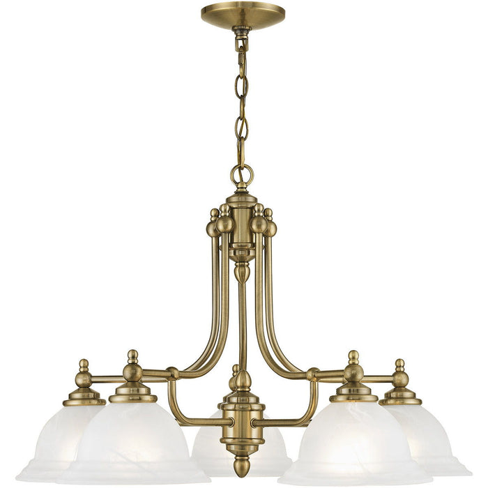 Five-light metal chandelier with white shades and antiqued brass finish, featuring dimmable lighting and elegant design.