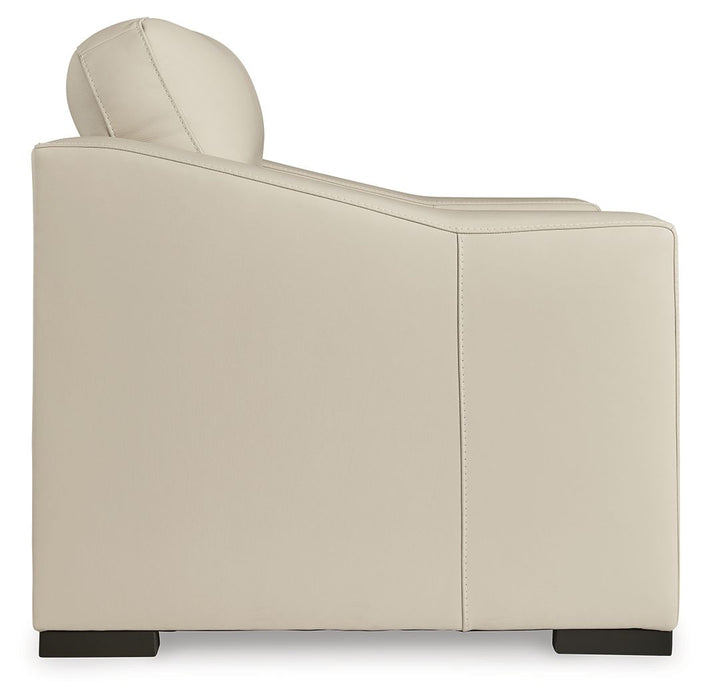 Signature Design by Ashley Treasure Trove almond stationary chair and ottoman set with plush upholstery and modern design.