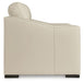 Signature Design by Ashley Treasure Trove almond stationary chair and ottoman set with plush upholstery and modern design.