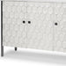 Gray and white 47-inch wood and metal carved geometric accent cabinet with three doors, from HomeRoots.