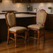 Set of two HomeRoots fabric and solid wood counter height bar chairs in beige and brown with cushioned seats and wooden legs.