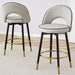 Set of 2 Giga modern upholstered bar stools with 360° swivel and metal legs, perfect for dining room seating.