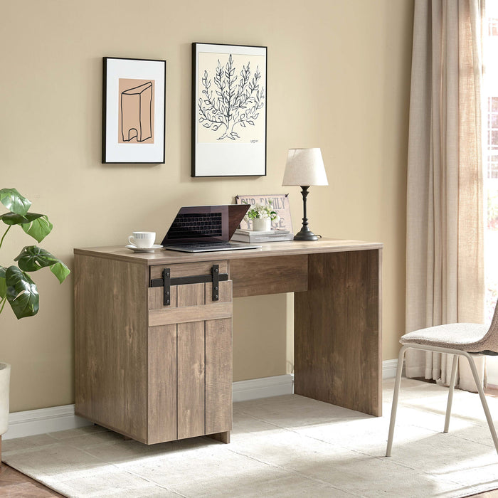 Giga Home Office Desk in light brown with hazelnut finish, featuring one cabinet, three shelves, faux barn door, metal hinges, and modesty panel.