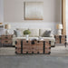 Set of three Giga trunk and side tables in antique gray with large storage compartments, ideal for living room decor.
