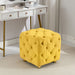 Giga modern upholstered ottoman serving as a small end table and soft foot stool in living room or bedroom decor.