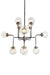 HomeRoots Sputnik eight-light metal chandelier with black and white shades, modern design, hanging fixtures on a ceiling.
