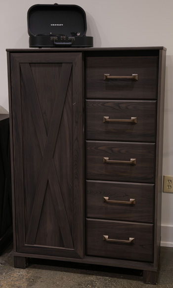 Dark brown Vonitta Bay dressing chest by Signature Design by Ashley® featuring sleek accent chest design with multiple drawers.