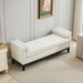 Elegant ivory boucle upholstered bench with wood legs and bolster pillows, versatile daybed or ottoman from Giga.