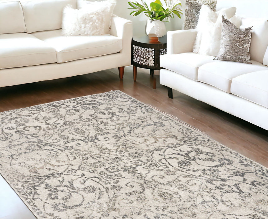 9' x 13' Machine Woven Distressed Floral Vines Indoor Area Rug - Ivory