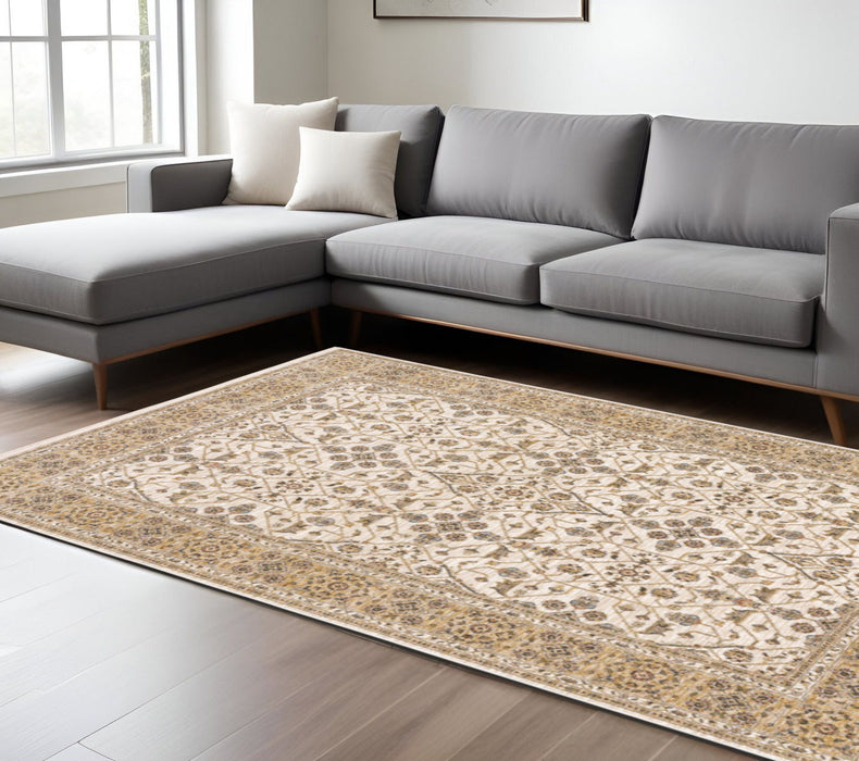6.6' x 9.7' Oriental Power Loom Stain Resistant Area Rug With Fringe - Gold And Ivory