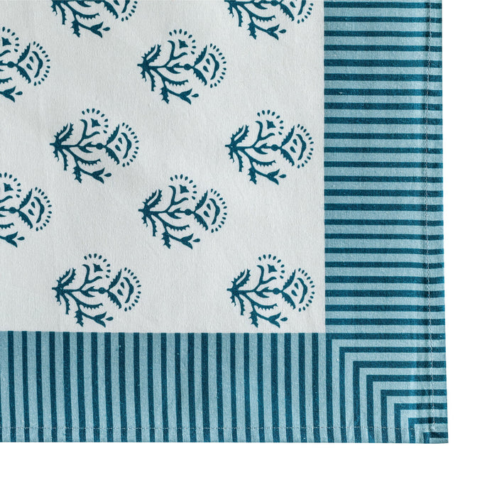 Set of four TOV Furniture Crissy cotton canvas printed napkins with blue vintage floral design, perfect for table setting.
