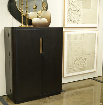 Black Haldenwick wine cabinet by Signature Design Ashley with storage shelves and a sleek, modern bar cabinet design.