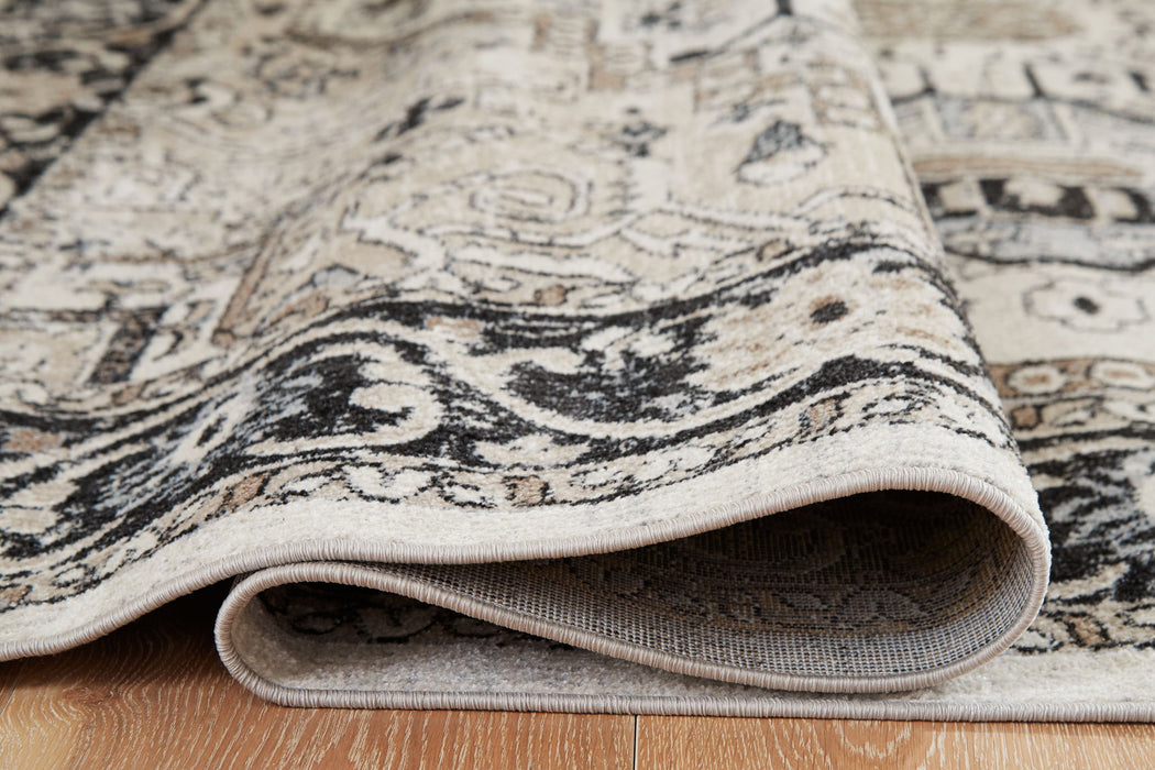 Ashley Furniture Gregmoore washable area rug with a detailed pattern, designed for easy cleaning and durable use.