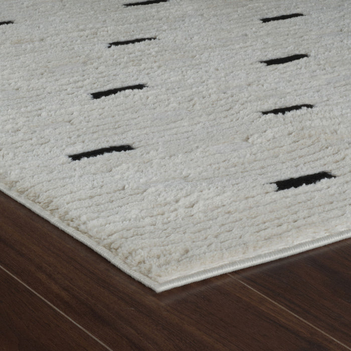8' x 11' Abstract Distressed Polypropylene Area Rug - Cream And Black