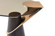 Round wooden and glass pedestal end table by HomeRoots with rose gold accents and clear glass top.