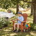 Red Giga Kids Adirondack arm chair suitable for indoor and outdoor use, featuring a sturdy wooden design for children.