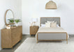 CoasterElevations Arini 4-piece Eastern King bedroom set in sand wash and grey with matching bed frame and side tables.