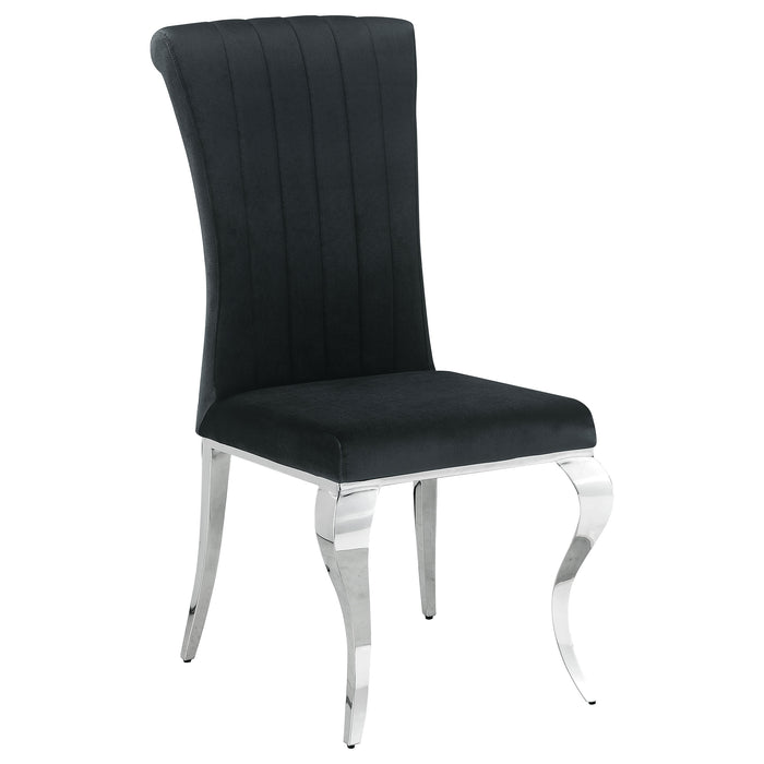 CoasterElevations Carone 5-piece black glass rectangular dining set with matching chairs on a modern dining room floor.