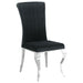 CoasterElevations Carone 5-piece black glass rectangular dining set with matching chairs on a modern dining room floor.