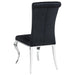 CoasterElevations Carone 5-piece black glass rectangular dining set with black chairs, ideal for modern dining rooms.