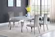 CoasterElevations Carone 5-piece white glass dining set with rectangular table and grey upholstered chairs, 81-inch size.