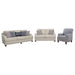 CoasterElevations Glenn 3-piece upholstered sofa set in light grey and blue fabric with plush cushions and wooden legs.