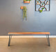 Natural acacia wood dining bench by CoasterEssence with a smooth, polished finish and sturdy construction for kitchen or dining room.