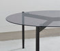 Round smoked glass top coffee table in grey with sleek metal legs, modern furniture piece by CoasterEveryday.