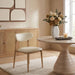 Vegan leather upholstered Ronda dining side chair with natural wooden legs, modern design, and cushioned seat by Meridian Furniture.