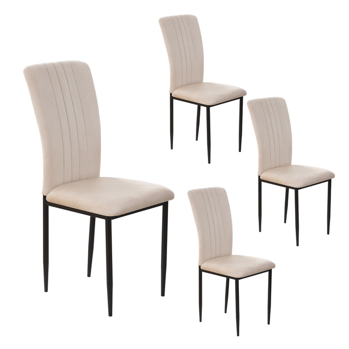 Set of four Giga velvet dining chairs with cushioned seats and sleek legs, perfect for modern dining room decor.