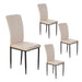 Set of four Giga velvet dining chairs with cushioned seats and sleek legs, perfect for modern dining room decor.