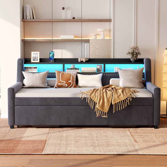 Dark gray Giga twin size storage daybed with trundle, LED light, and charging station, featuring a modern design with built-in storage.