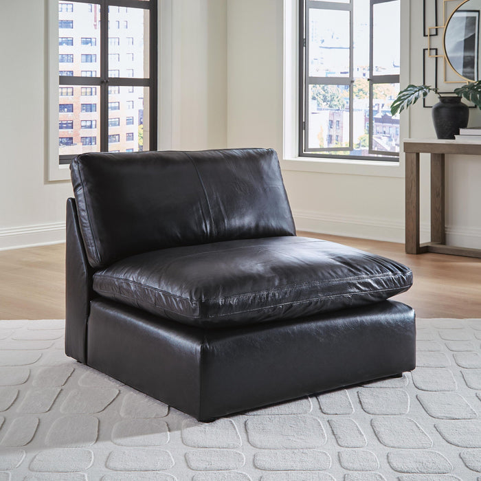 Emilia stationary sectional sofa by Signature Design Ashley featuring plush cushions and modern fabric upholstery.