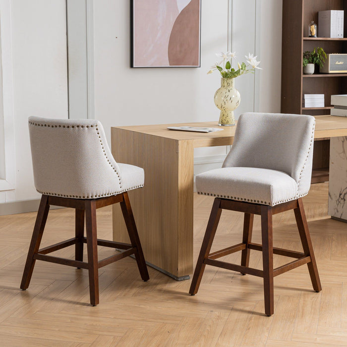 Set of two Giga counter height swivel barstools with upholstered fabric seats, 26-inch height, and modern design.