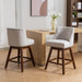 Set of two Giga counter height swivel barstools with upholstered fabric seats, 26-inch height, and modern design.