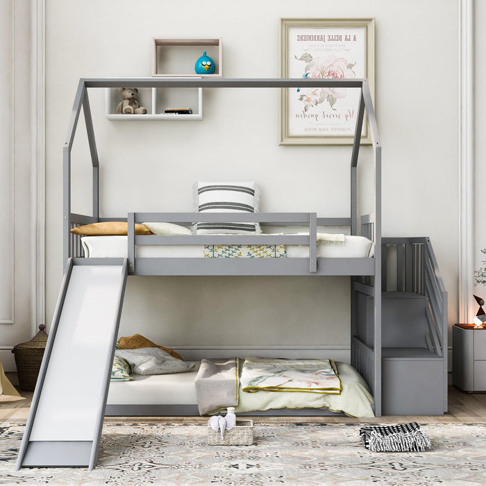 Giga twin over twin house bunk bed with convertible slide, storage staircase and safety rails in a modern children's bedroom setting.