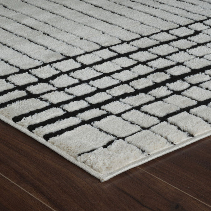 8' x 11' Modern Abstract Distressed Polypropylene Area Rug - Cream And Black