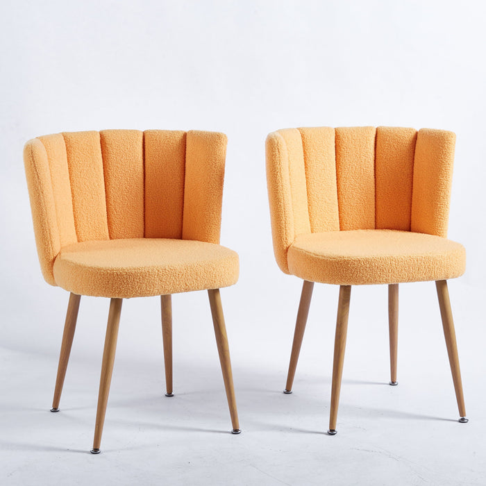 Set of two Giga modern dining chairs with wood-colored iron tube legs, cushioned seats, and comfortable backrests for dining or cafe spaces.