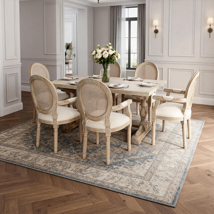 Set of two Giga French vintage upholstered fabric dining armchairs in beige, featuring elegant armrest design and padded seats.