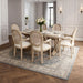 Set of two Giga French vintage upholstered fabric dining armchairs in beige, featuring elegant armrest design and padded seats.