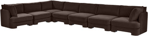 Velvet performance fabric upholstered 7-piece Meridian Furniture stationary sectional sofa in a modern living room setting.