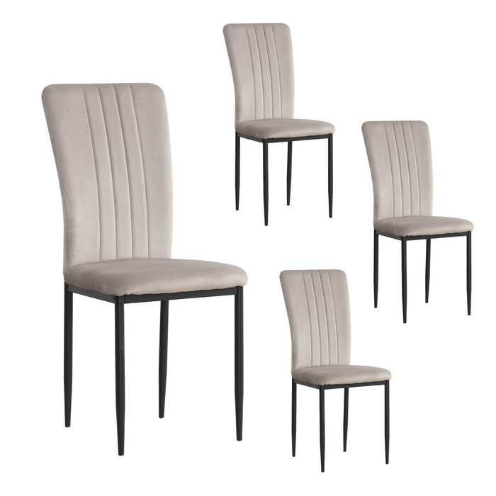 Set of four Giga velvet dining chairs with modern design, featuring plush upholstery and sleek wooden legs for elegant dining room decor.