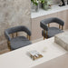 Set of two Giga decorative upholstered side chairs with cushioned seats and stylish fabric for living room decor.