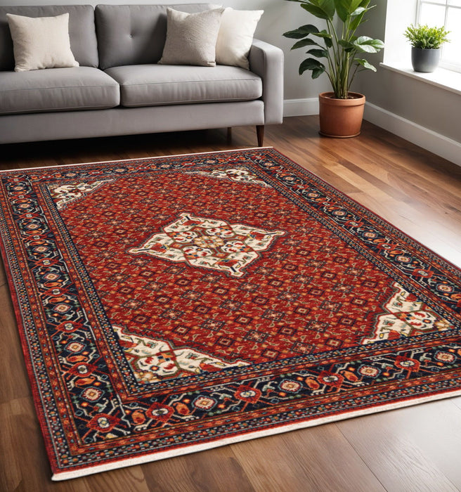 5' x 8' Oriental Power Loom Stain Resistant Area Rug With Fringe - Red Blue Ivory And Orange