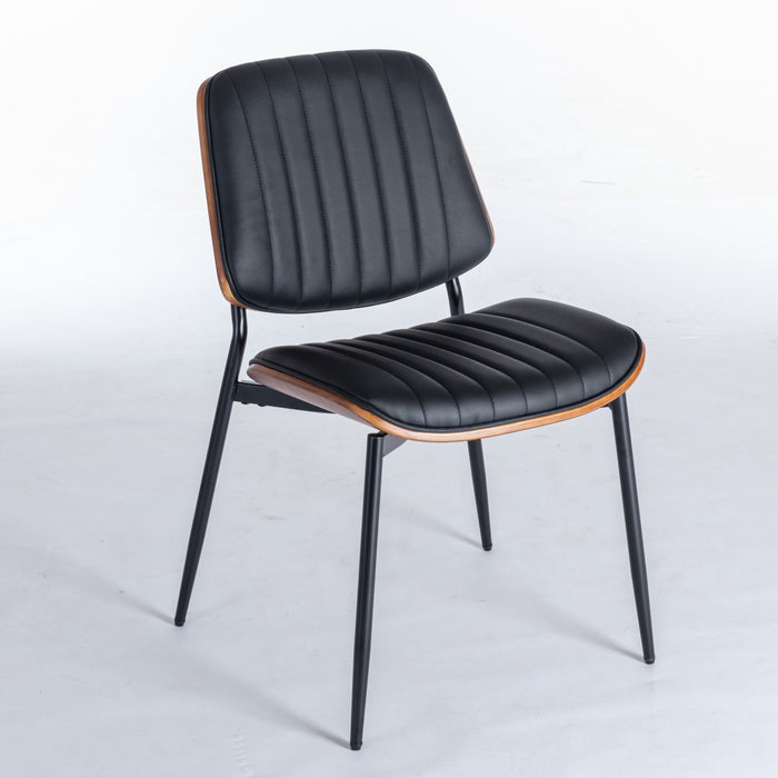 Set of two Giga mid-century modern dining chairs with walnut bentwood backs, upholstered seats, and metal legs for kitchen or dining room.