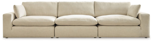 Benchcraft Elyza 3-piece stationary sectional sofa with plush cushions and modern design, perfect for spacious living rooms.